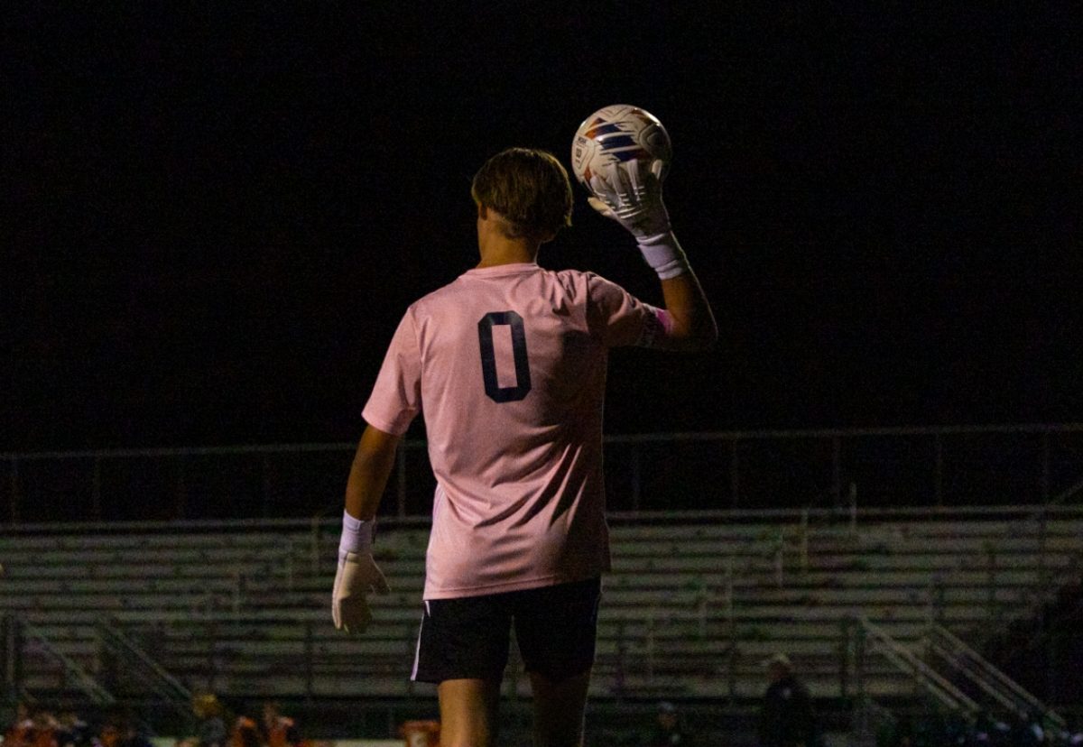 After catching the ball during the Francis Howell North game on Sept. 10, senior Cooper Kambak looks to decide where to throw the ball to help best benefit them. Goalies use their players in order to better place the ball when they get it back in their possession. 
