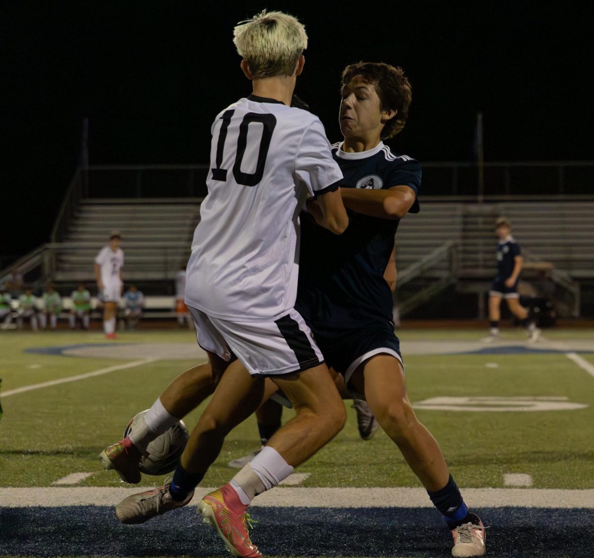 Junior Jude Green fights with a player from the opposing team for the ball. At the game against Francis Howell North on Sept. 10 he is attempted to get possession of the ball to then passed to a teammate. 
