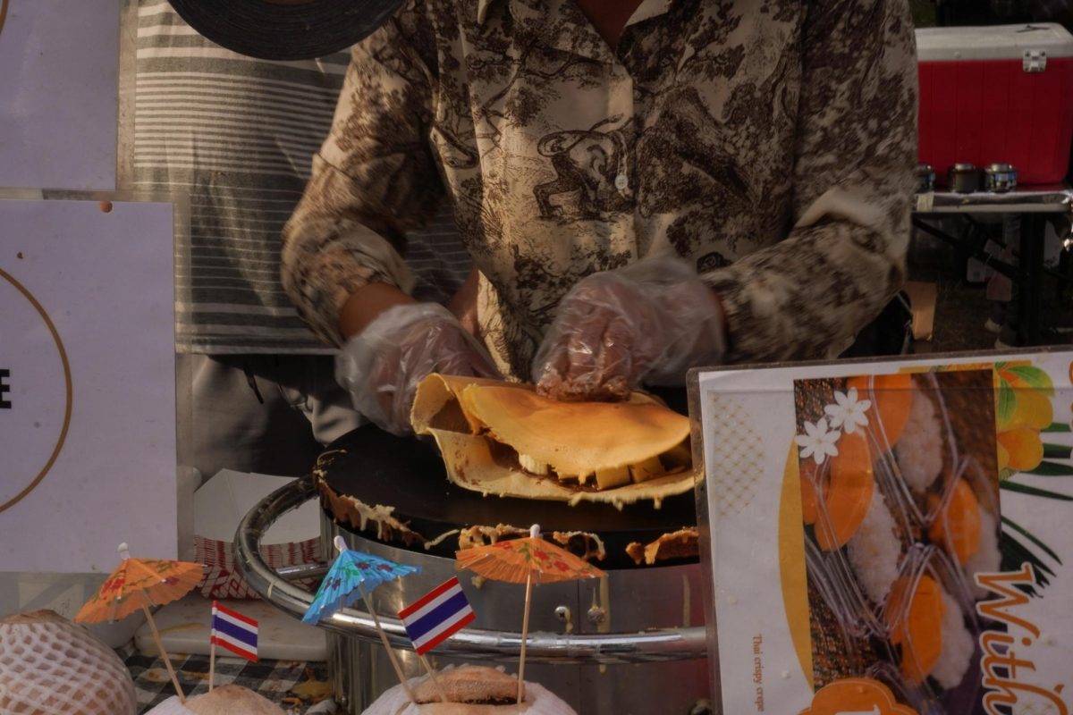 A Taiwanese food vendor makes a crepe. Hundreds of countries had their own food stands at the festival.