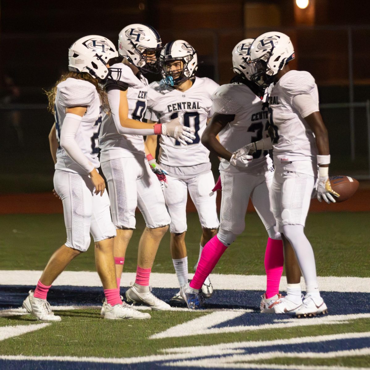 Junior Don Thornton, with the ball in his hand, shakes hands with his teammates as they congratulate him. Thornton had scored the 4th and final touchdown of the game.