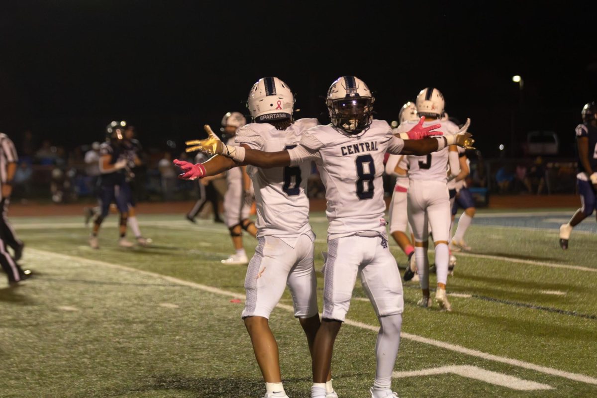 Juniors Ashton Payton and Don Thornton stand back to back as they celebrate the touchdown just scored. The two have perfected a routine they perform after every touchdown is scored.  
