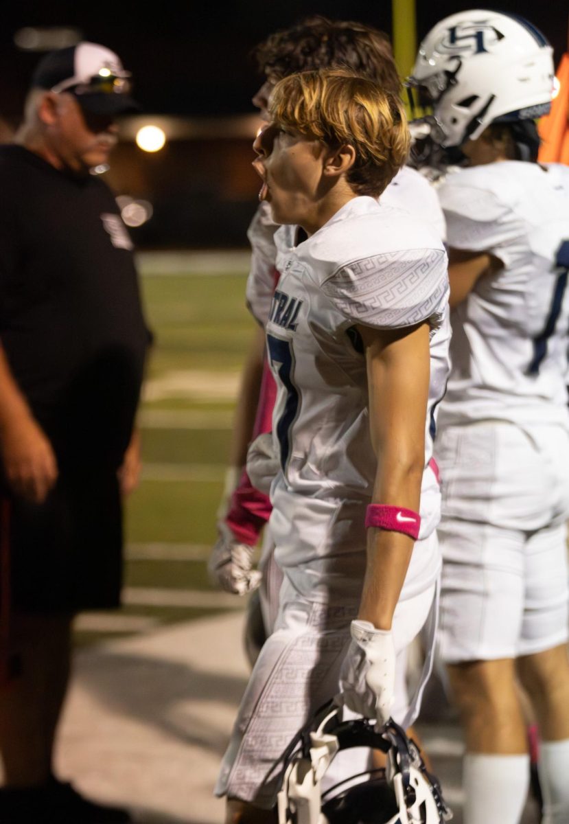 Senior Riley Winkler screams from the sidelines at his teammates. He cheers them on as they make their way down the field, securing a spot closer to another touchdown.
