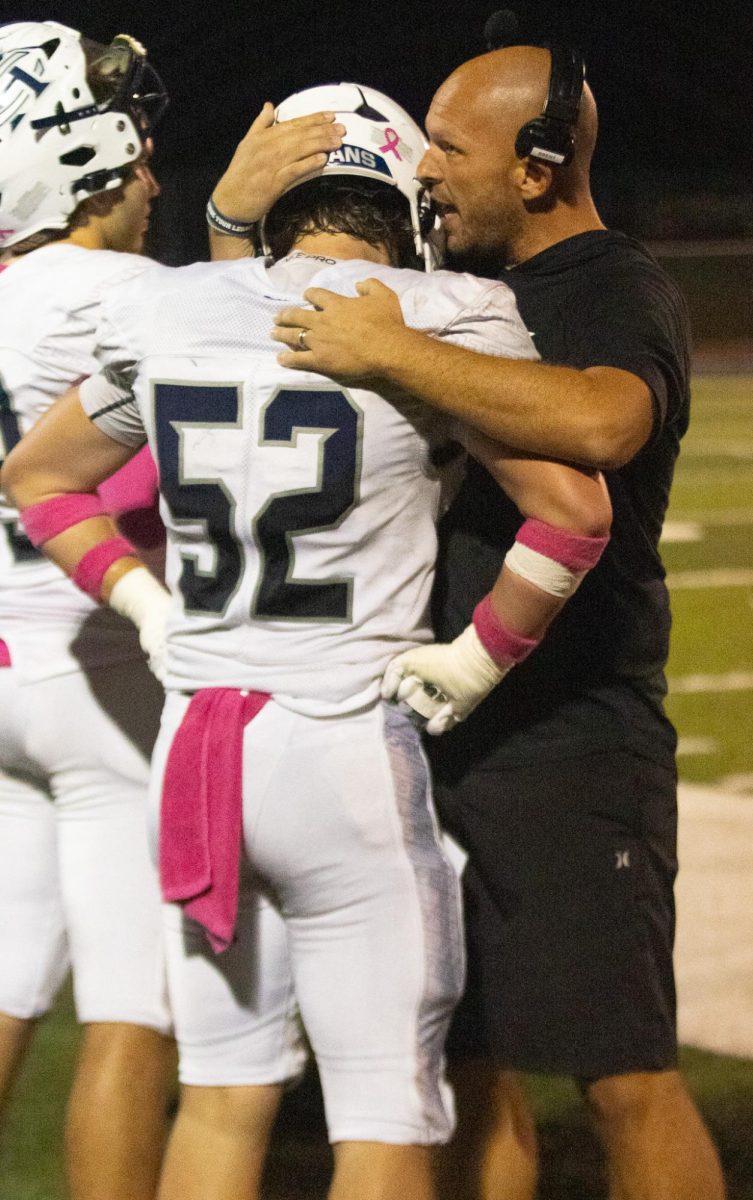 Senior Gavin Peraino, in his senior year, gets advice from assistant coach Brent Holtgrewe. Holtgrewe tells Peraino he is working hard and encourages him to keep up the good work.
