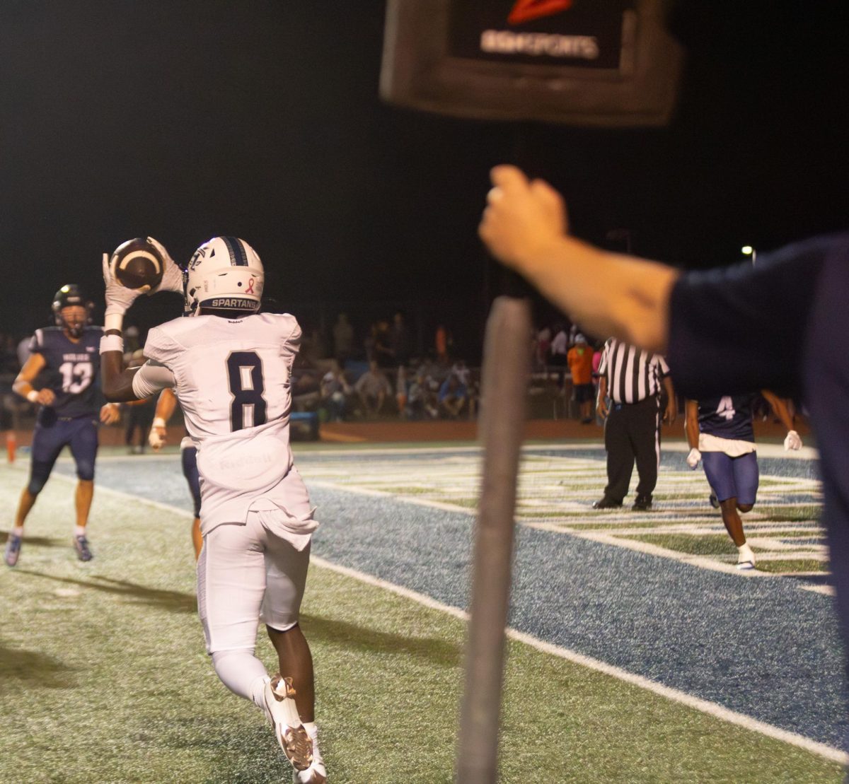 Junior Don Thornton runs towards his opponents as he puts his hands up to catch the quick ball. Knowing he must act quickly to try and score for his team.