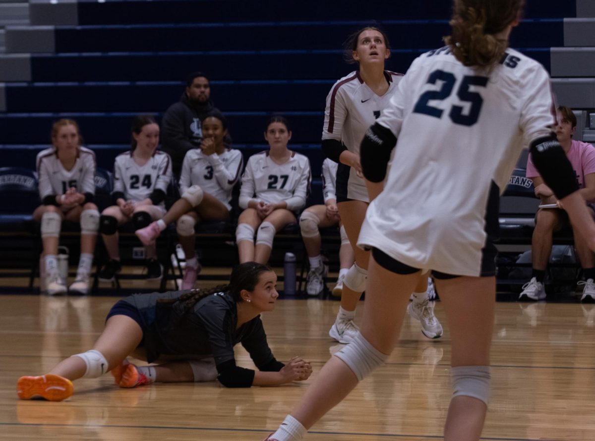 Howell spikes a ball downwards straight at sophomore Natalie Hirth, causing her to dive so she can get the ball up for her teammates to play out. While a dive isn’t preferred because control is lost, it can be necessary in order to keep the ball in play.