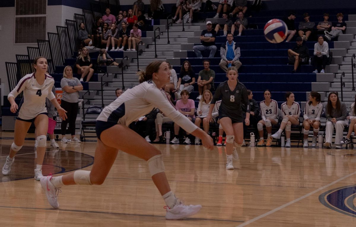 As the ball accelerates towards the floor, senior Jordan Smith dives forward to prevent her team from losing the point. Throughout the game, Smith kept her eye on the ball and prepared for Howell's spikes before contact was made by the opposing team.