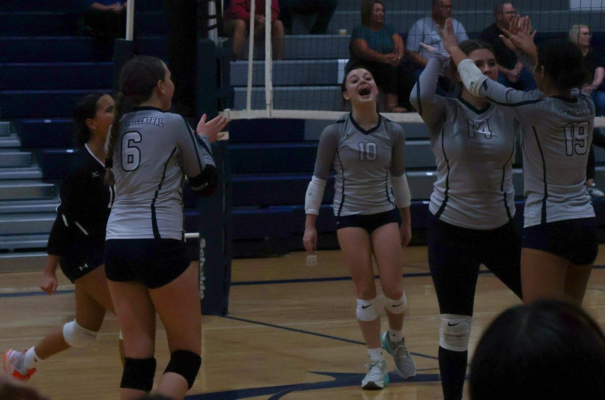 The Spartans celebrate together after winning the second set causing the game to go into a third set. During the game against Troy Buchanan on Oct. 1 which took place at the Spartan's home court.