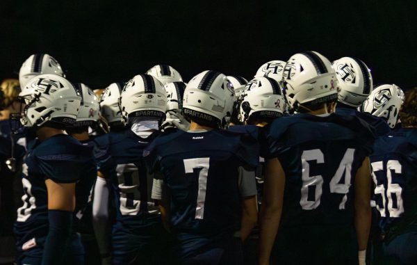 On Sep. 27, 2024 the Francis Howell Central Spartans huddle up before their game against Troy. Both teams have been conference rivals for years.