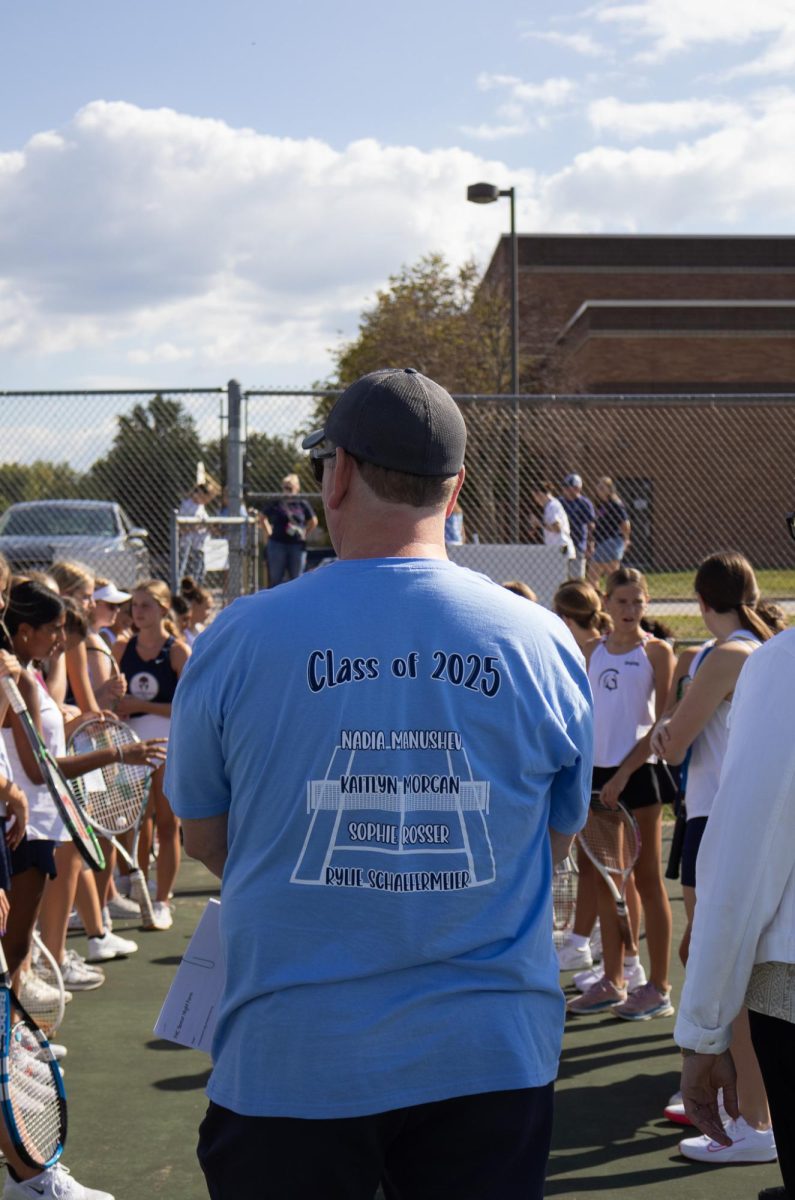 Head coach Patrick Reed stands at the end of the line of players, awaiting the seniors. Reed read off a quick script for each senior player to celebrate their time with the team. 
