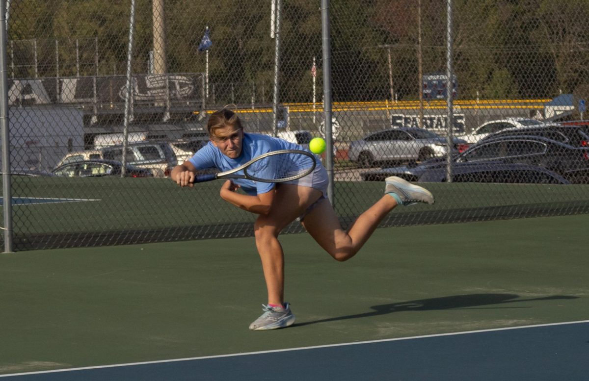 Sophie Rosser lunges towards a ball, fighting hard to keep the play going. Rosser and her teammate, Nadia Manushev, both played hard in their senior night game.