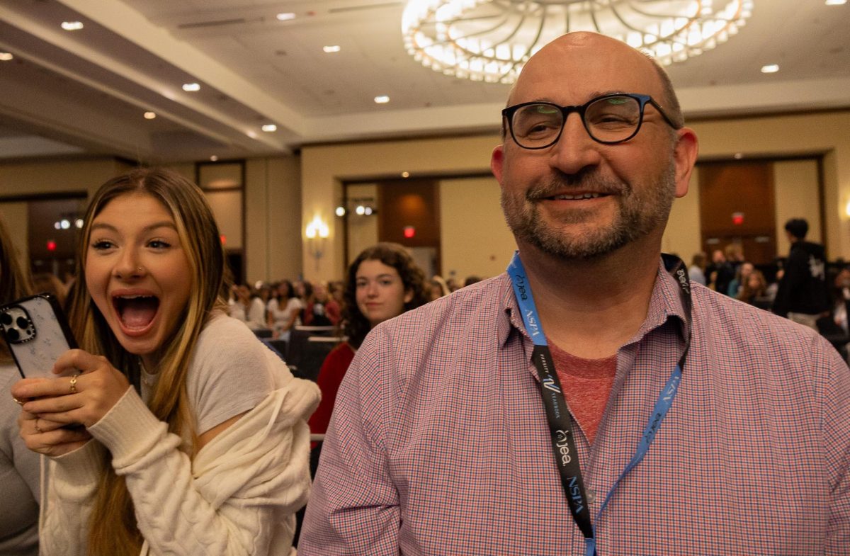 Smiling widely, Mr. Matthew Schott looks at his students with pride. Taking home their final award of second place for FHCToday.com in the website category, Schott was very happy with how publications placed at the awards ceremony. 