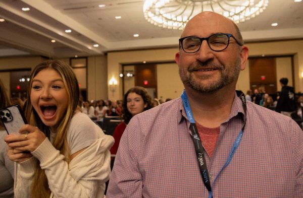 Smiling widely, Mr. Matthew Schott looks at his students with pride. Taking home their final award of second place for FHCToday.com in the website category, Schott was very happy with how publications placed at the awards ceremony. 