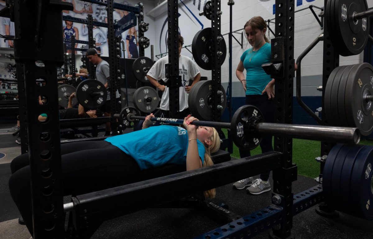 Introduction to Weight Training students work on their bench presses. Bench presses happened to be one of the first lifts students learned how to properly do at the beginning of the year.