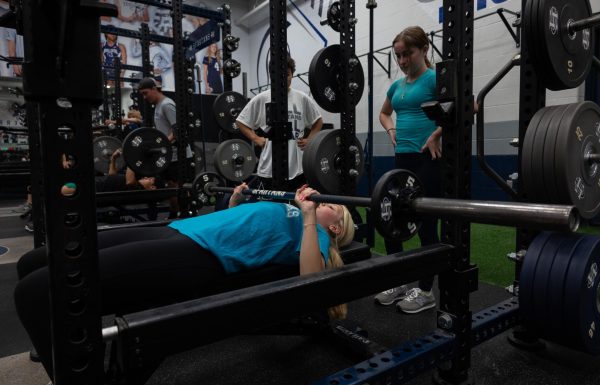 Introduction to Weight Training students work on their bench presses. Bench presses happened to be one of the first lifts students learned how to properly do at the beginning of the year.