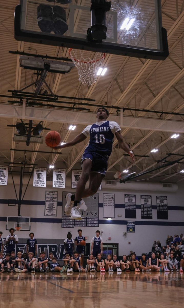 Soaring through the air, junior Xavier Morrison windmills the ball into the basket during the annual winter blast held on Nov 15. Scoring perfect 10’s from the judges to win the contest against his teammates. 