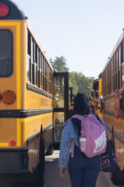 Students file down the rows of buses after school. For some, the bus they climbed onto was crammed to capacity.