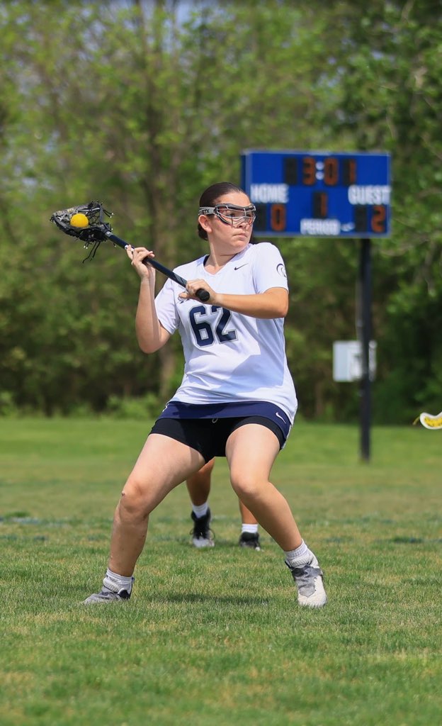 Sophomore Sydney Mursean looks up the lacrosse field, scanning for an open teammate. Balancing multiple sports helps Mursean explore different interests and relieve stress.