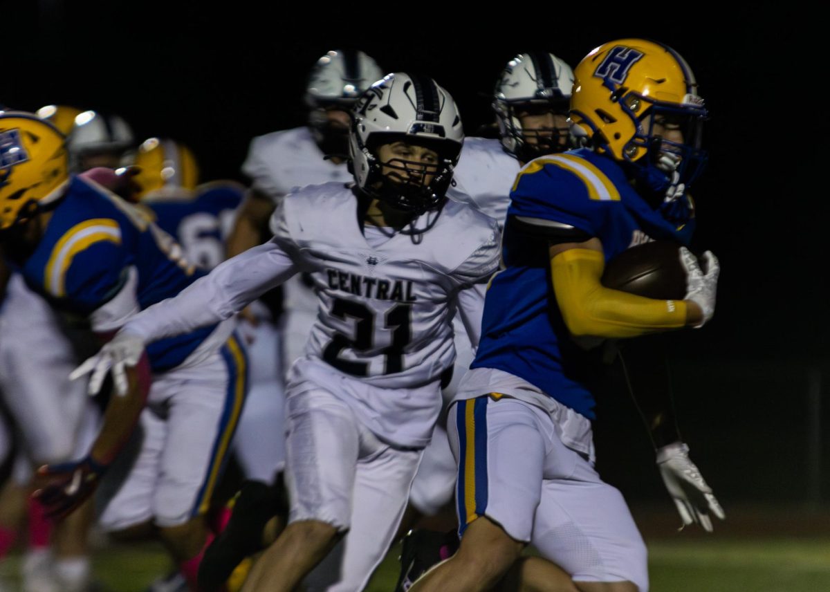 During the game at Francis Howell, sophomore Jackson Chartrand tackles the opposing team. Chartrand was able to stop the play and prevent the opposing team from gaining more yardage. 
