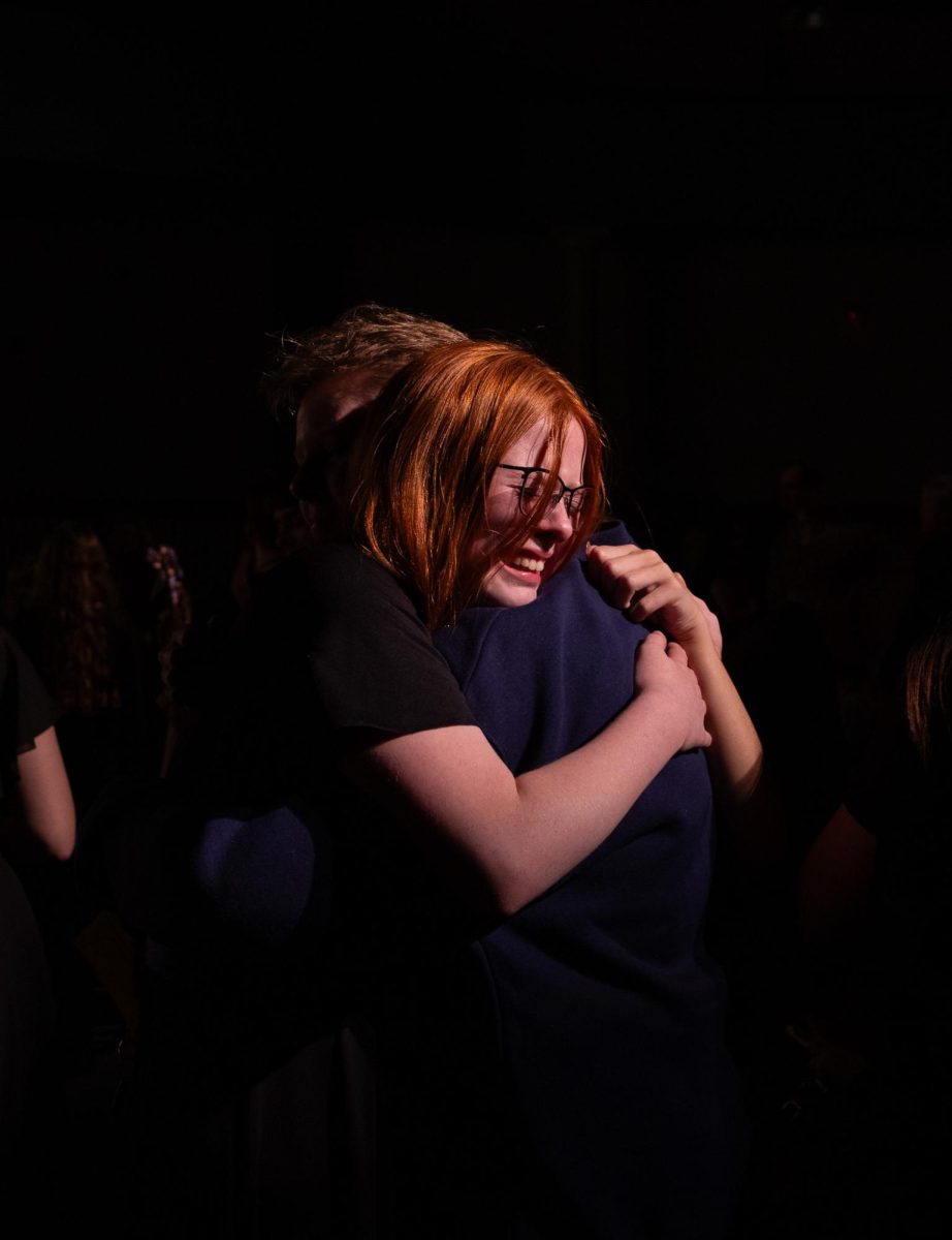 Embracing their friend is alumni Jaida Neufarth and sophomore Mady Ashlock. With the conclusion of the concert emotions ran high and friends and family all swarmed to congratulate their singers.