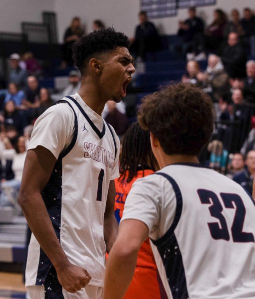 Junior Xavier Morrison lets out a celebratory yell after scoring against North Point. The Spartans won 86-59.