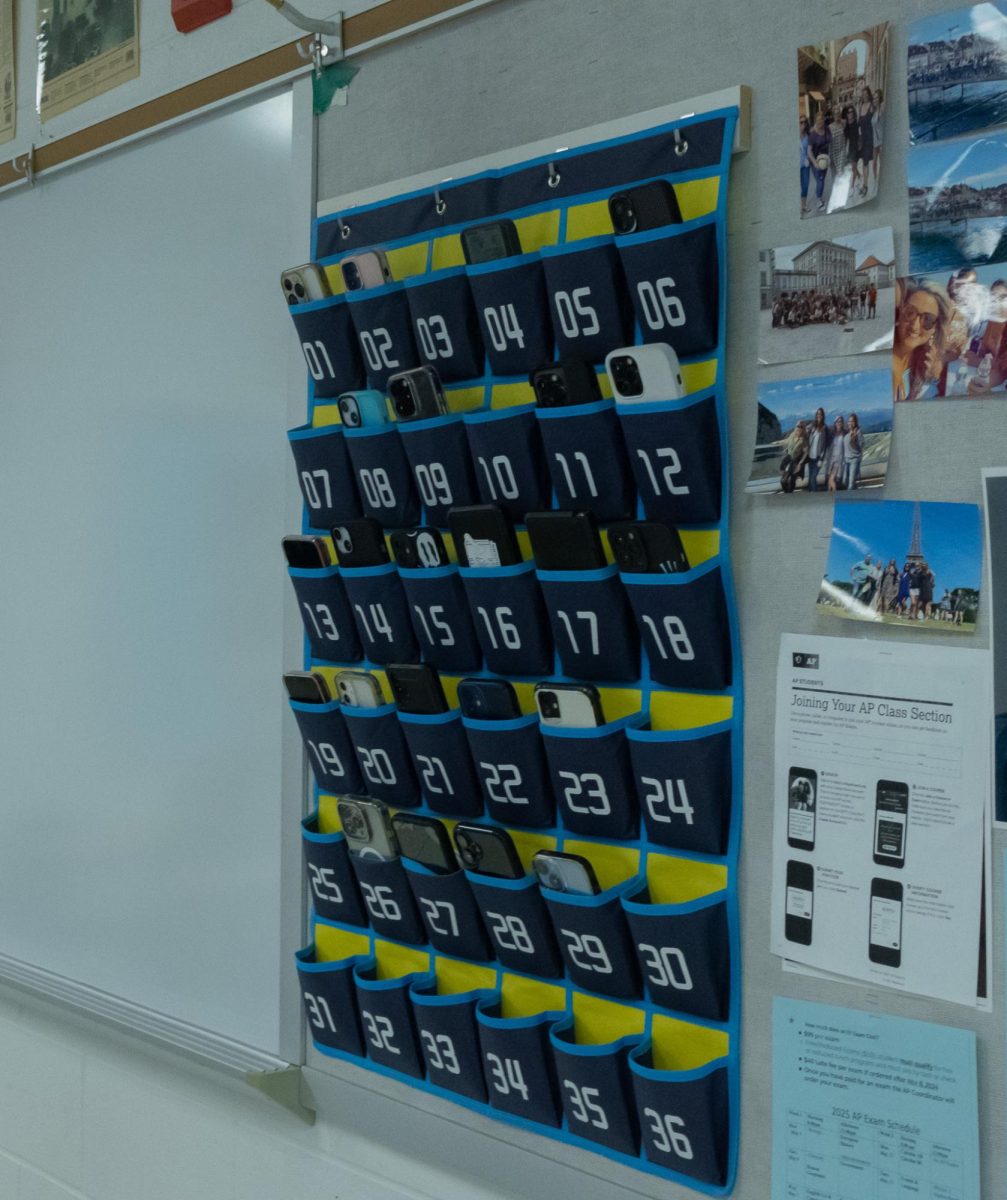 Students' cell phones sit in numbered pouches during Mr. Donald Lober's Modern World History class. Some students and teachers refer to this system as a "phone jail."