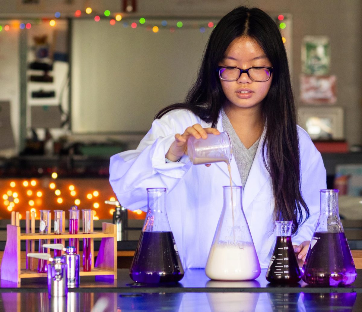 Illuminated by a purple glow, junior Katie Huynh begins to pour a yeast mixture into the beaker. As the yeast meets the rest it combines to create a rapidly expanding foam. Huynh gazes towards the experiment, awaiting the outcome. Huynh strives to learn more constantly which is one of the reasons that she played an important  role in founding the Girls in STEM club at Francis Howell Central. Huynh surrounds herself with things pertaining to science because she appreciates the effort that is necessary to understand them. 

“We get to problem solve and even if we don't understand a part of what we are doing, we get to figure it all out ourselves and make sense of what is given to us,” said Huynh.

Huynh has found, with her fondness for science, that the importance does not lie in how much someone knows, but how much someone commits to learning. 