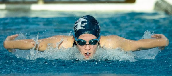 Sophomore Kylee Call Rolon’s body surges out of the water as she takes a breath in between her butterfly strokes. After continuously pushing herself throughout her event, she helped her relay team earn second in the butterfly relay.