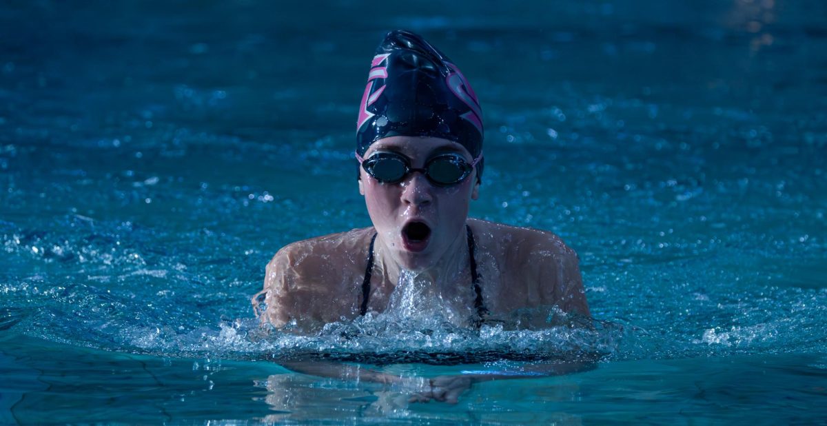 During the medley relay, sophomore Sarah Turner comes up for air during her breaststroke. It's important that the swimmers come up for air regularly so they don’t run out of breath which would lead them to become tired during their race.
