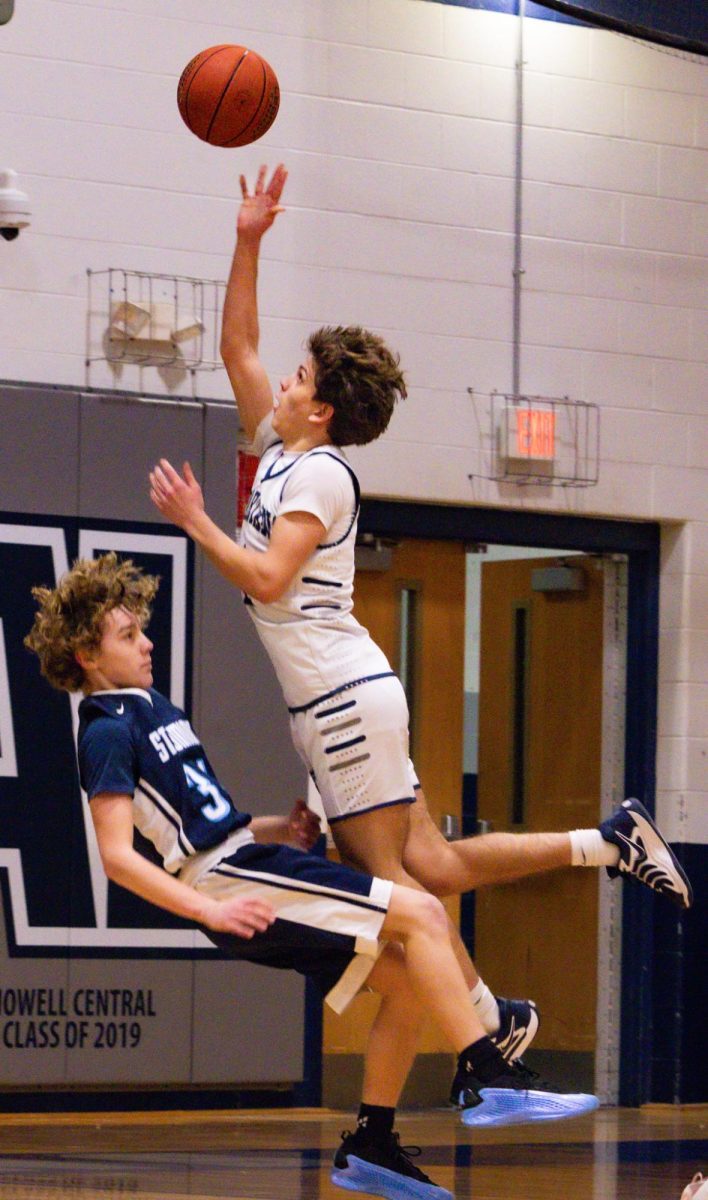 Taking the ball up strong on the right side, freshman Will Schuster knocks his defender to the ground. Despite this contact, no foul was called on either player.