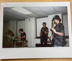 Playing his guitar, senior Hudson Gillming (right) regularly rehearses alongside his college friends at Saint Louis University. (Photo courtesy of Hudson Gillming)