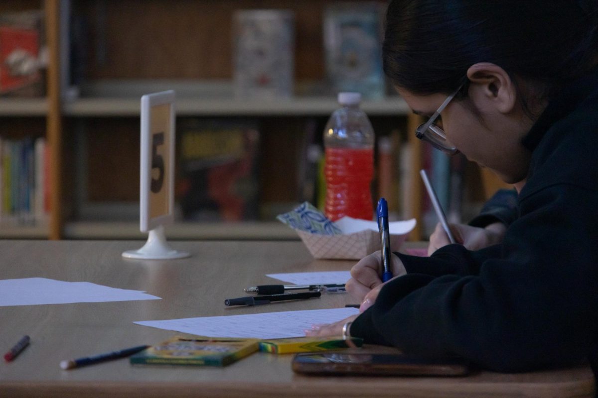 Junior Anshdeep Thind leans over the desk as she fills in the brainstorming sheet with her own ideas of what FHC’s mission is. With the diverse student and staff population, it can be challenging to come up with a statement that includes them all.