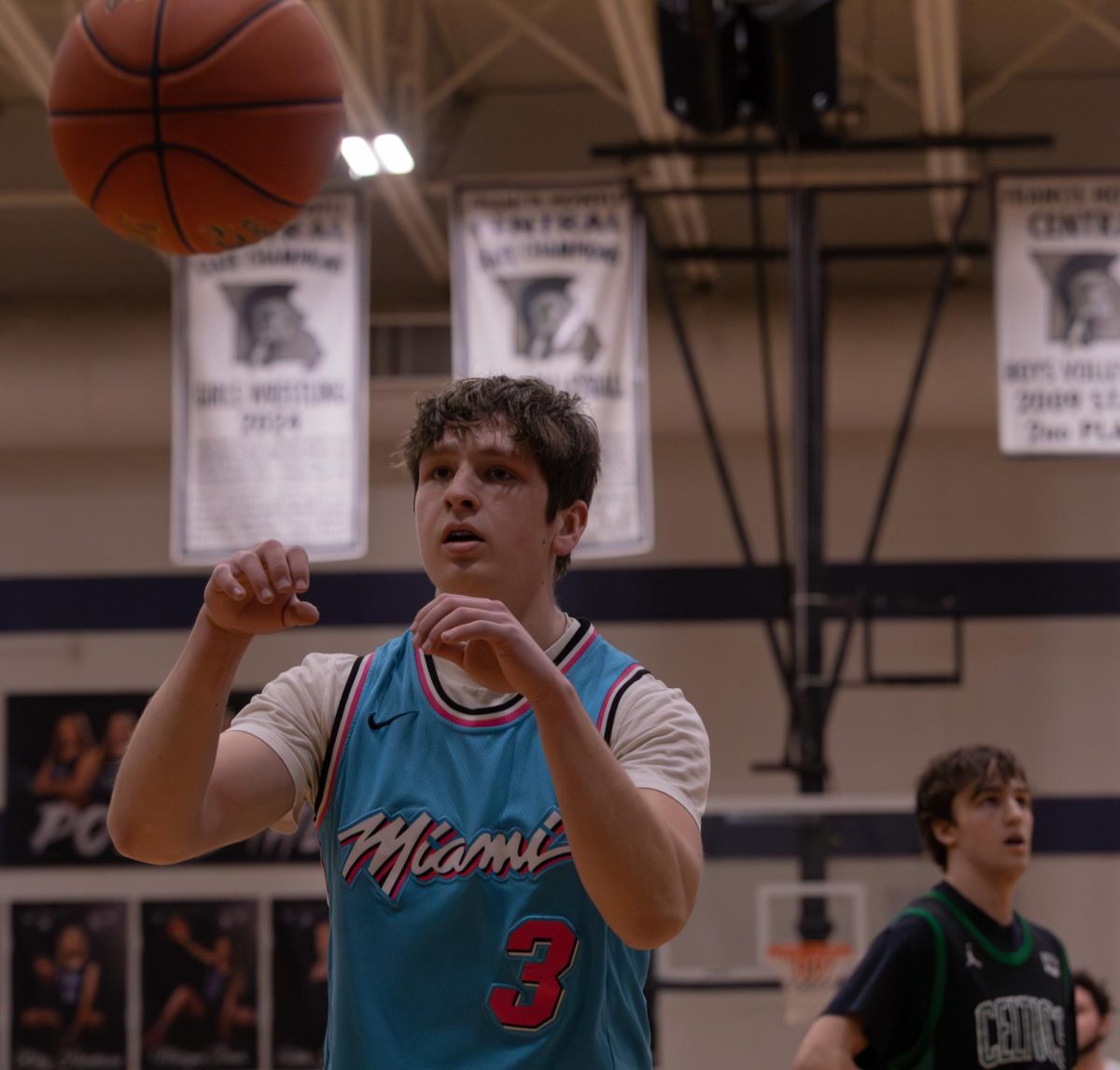 Senior Andrew Martin receives a pass from his teammate after the ball went out of bounds. Once Martin received the ball, he was able to dribble down the court and pass to another player. 
