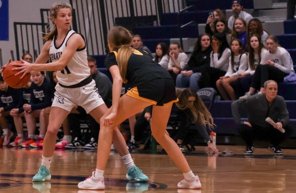 Swooping the ball away from her opponent's reach, Riley Henderon searches for an open teammate to take the ball all the way to the basket. While Henderson was prepared to laser focus on the game, the energy around her and her teammates led to an enjoyable game.
