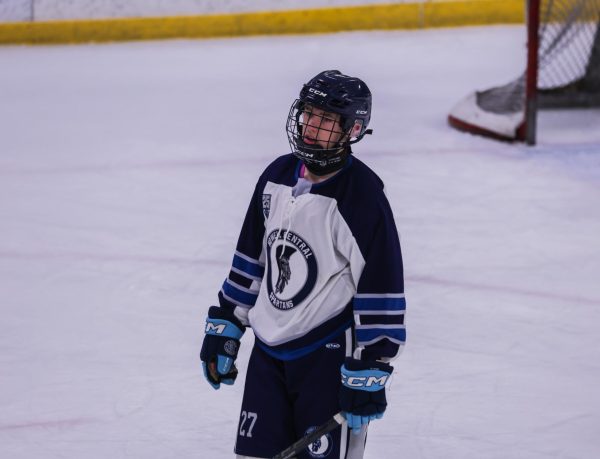 Freshman Mason Dietz looks up with intensity as he heads towards the face-off circle. He let out a heavy sigh after the other team scored against the Spartans. 