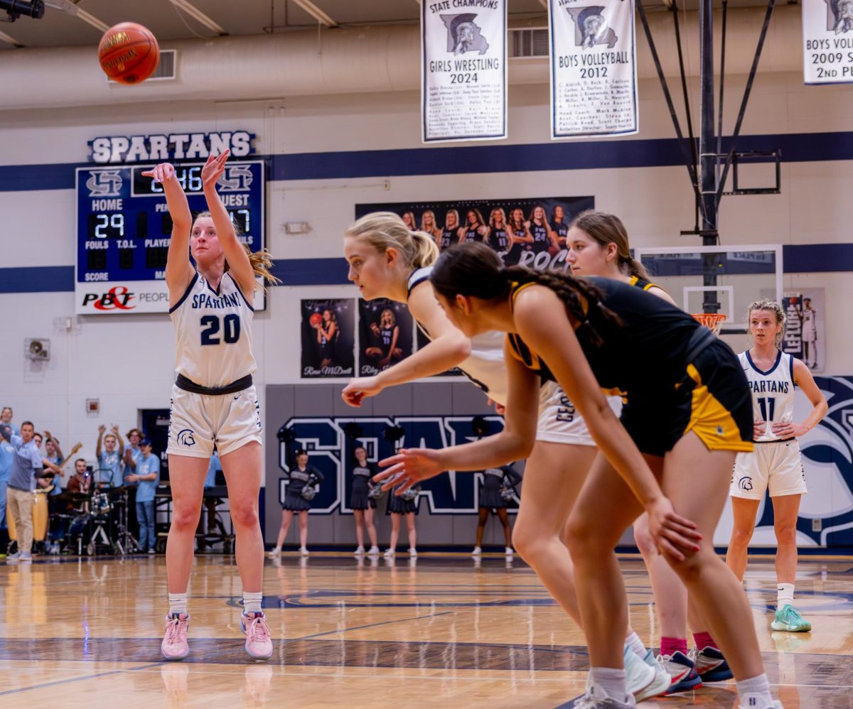 After getting fouled on by the point guard from Lafayette, junior Sam Taylor shoots a free throw in hopes of getting a basket for the Spartans. Taylor threw two free throws, banking both of them and keeping the Spartans in the lead.