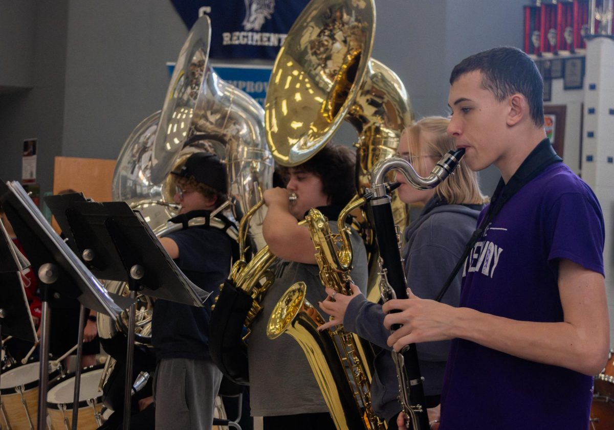 Sophomore Phelan Pelster plays the bass clarinet during a practice for band class. He is one of more than 120 people in the A-Band.