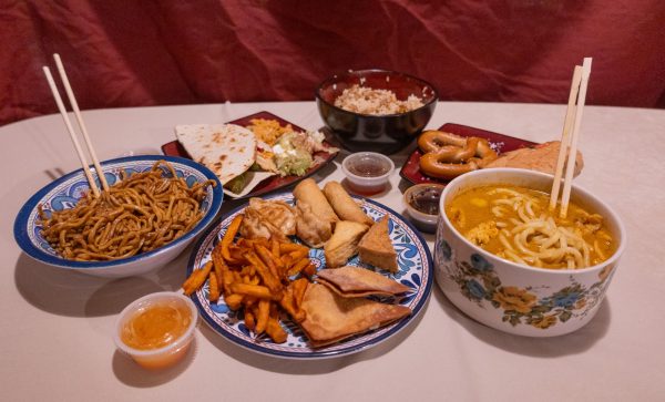 An array of various foods from different cultures lay on a table. These foods from around the world can provide many different insights on cultural heritage and traditions. 