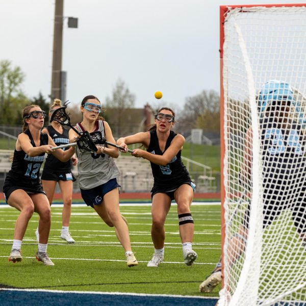 During the second quarter of the game, junior Brianna Lewis avoids her defenders and launches the ball into the net. The ball glided past Parkway West’s goalie, earning a goal for the team. 