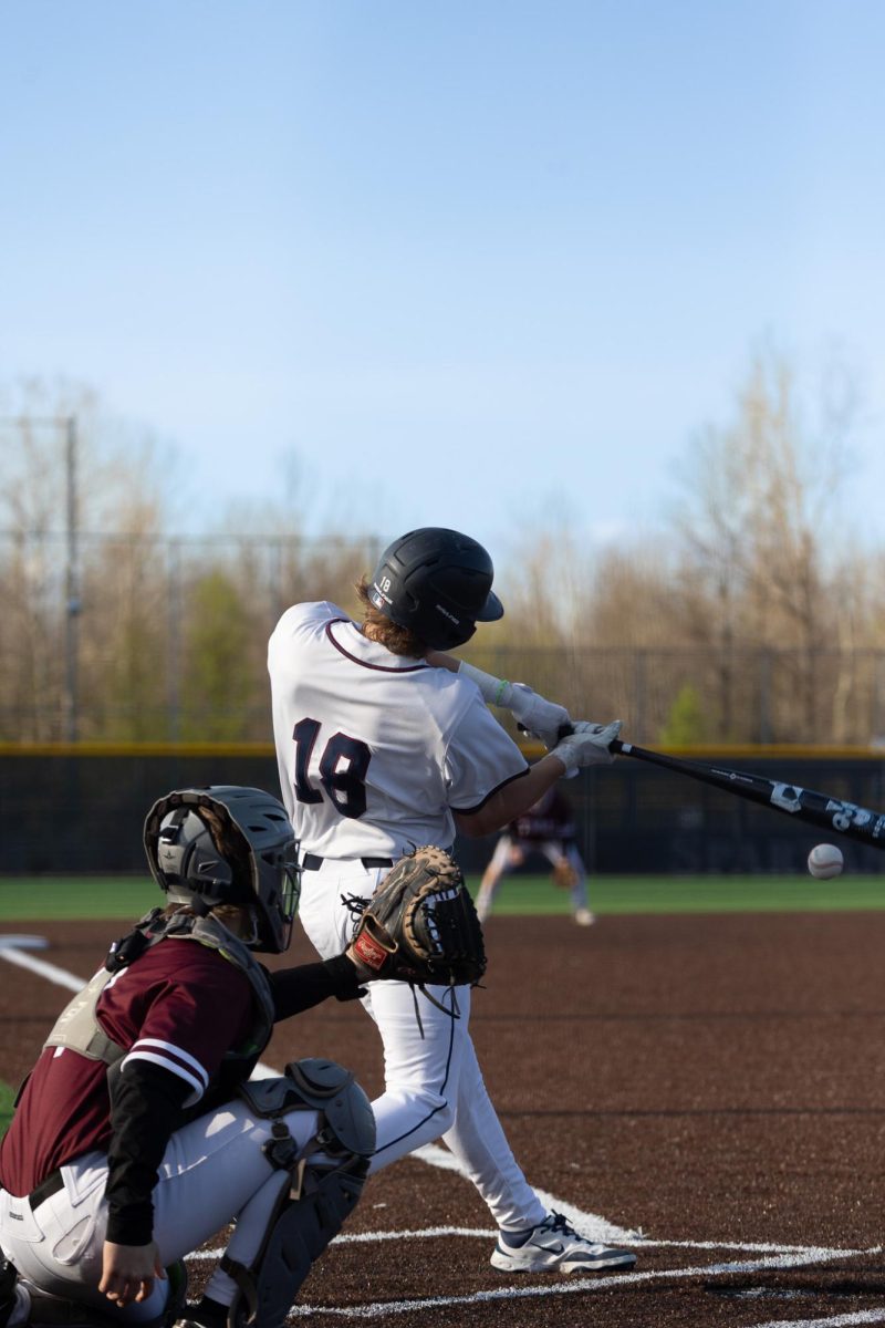 Freshman Rory Marshall hits a hard ground ball through the gap in between third base and shortstop. Then Marshall rounded first base, he then jogged back and talked to the first base coach