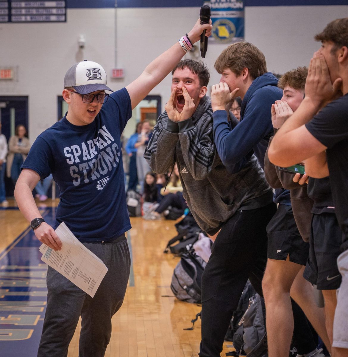 During the “FHC Say What” chant, senior Jeremy Kuhn walks around the gymnasium and stops in front of each grade. Kuhn began announcing the chant his junior year and has become a key highlight of the event.