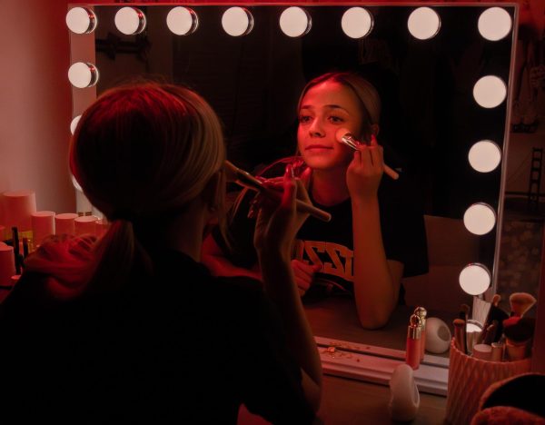 Ruled by the sun, Leo's are known to be very confident. While doing her makeup, senior Dani Jansen smiles into the mirror, highlighting her confidence and positive personality. 