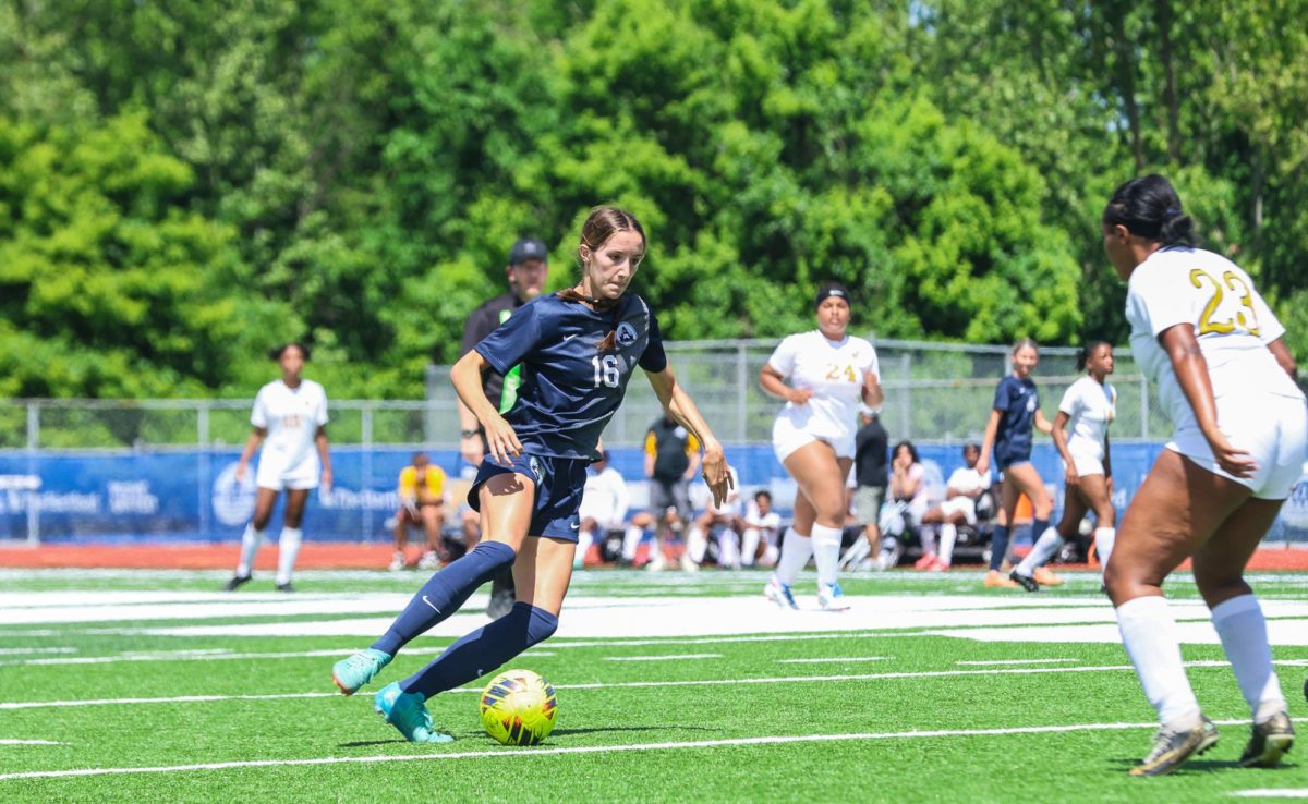 Junior Claire Casler  slides to the right as they dribble the ball past the other team’s defensemen. With a concentrated demeanor, Casler rushed past to score yet another goal.