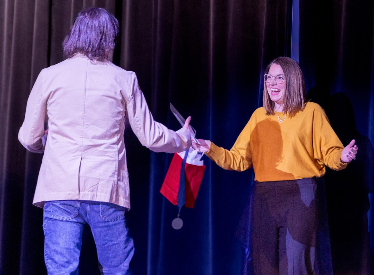 Mrs. Sarah LaRue revealing herself as the teacher who awarded senior Nate von Nida the silver shield. She was very excited to give von Nida the award during the ceremony.