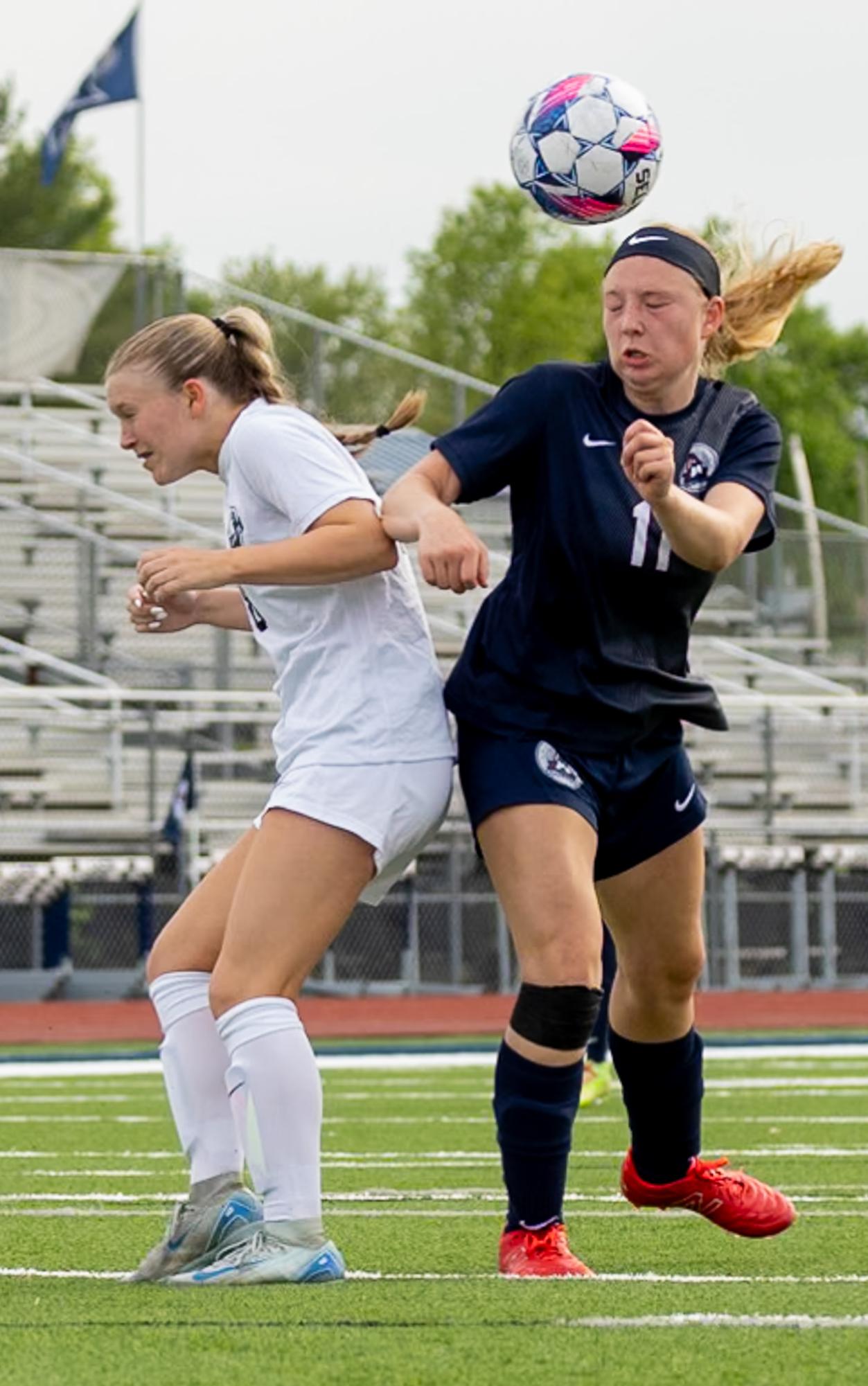 Closing her eyes upon impact, Cassie Durbin headbutts the ball as it comes down from a corner kick. Durbin pushed the ball to her teammates who were standing near the goalpost. 