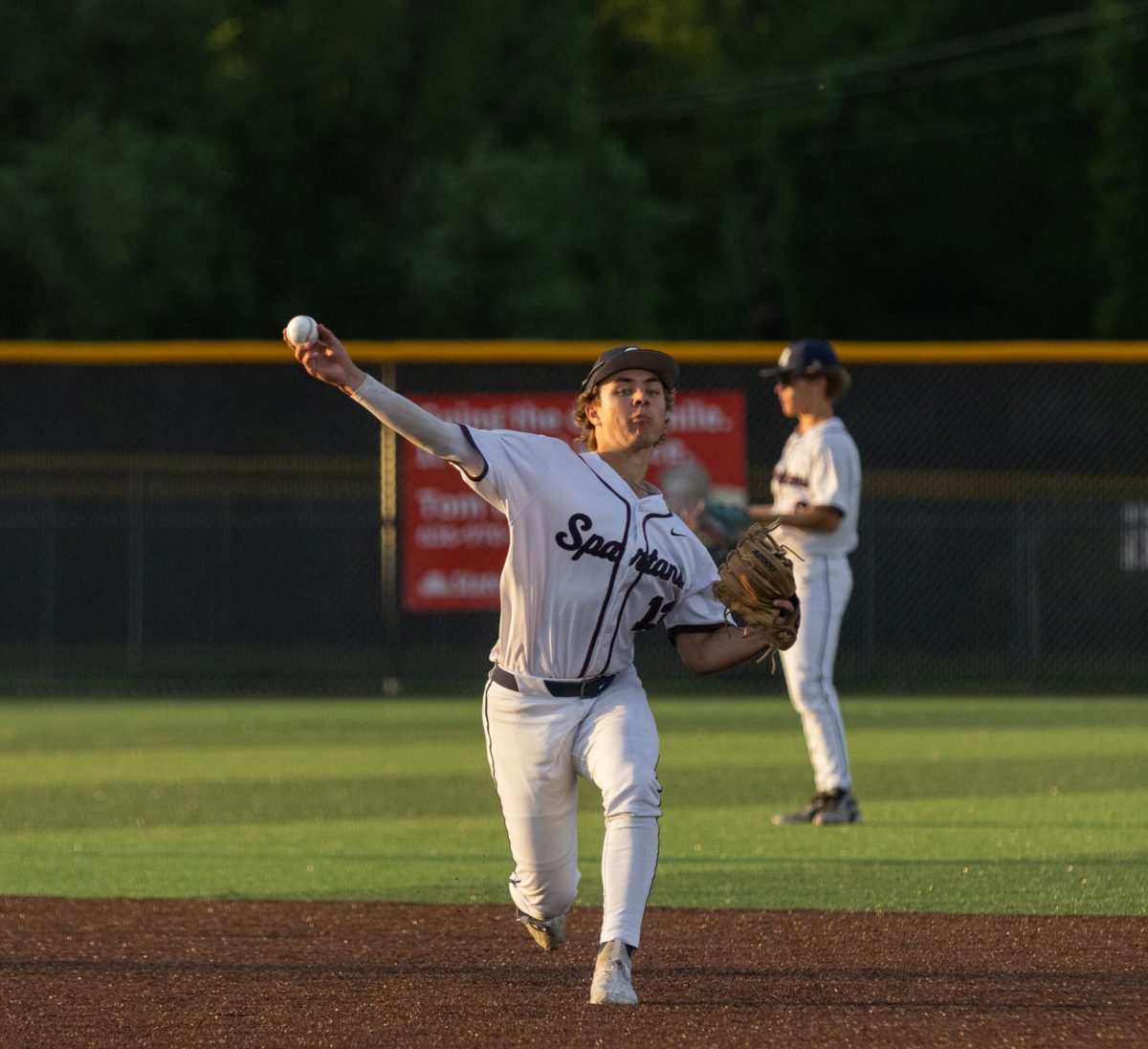 In between innings freshman Jackson Elliott fields a ground ball from his first baseman to work on last minute reps before the first batter. Elliott waited for his catcher to throw down to second so he could throw around the horn with the rest of the infield.