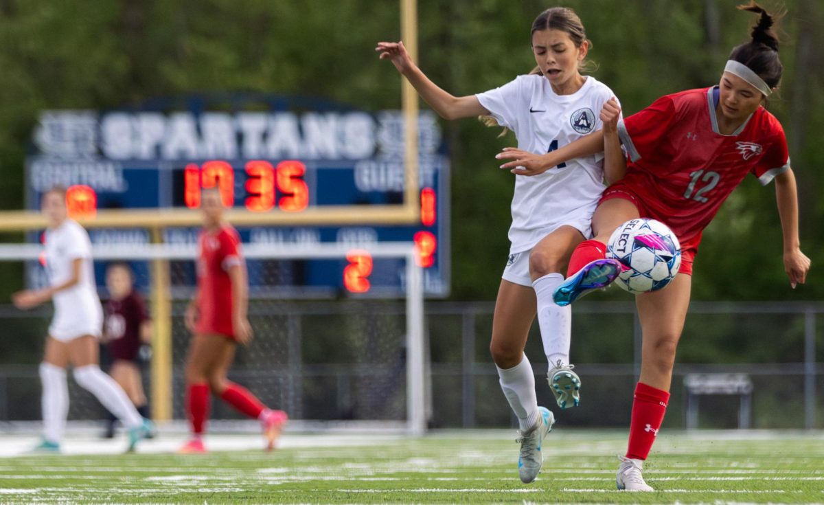 Meeting the Nixa player in the air, freshman Lily Limpert flings her leg at the escaping ball. As the final ten minutes continued, Limpert and teammates gave their all to steal the ball from the opposing players, hoping to even the score with the time left on the clock.

