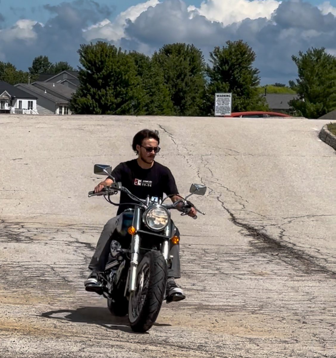 Senior Nate von Nida riding his motorcycle across his neighborhood. Von Nida feels free while riding his motorcycle in a way most don't experience. Photo courtesy of Nate von Nida.