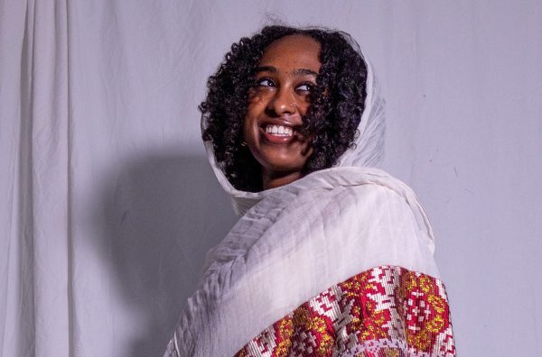 Junior Nuwelin Dagne beams in her traditional Ethiopian dress wear. 