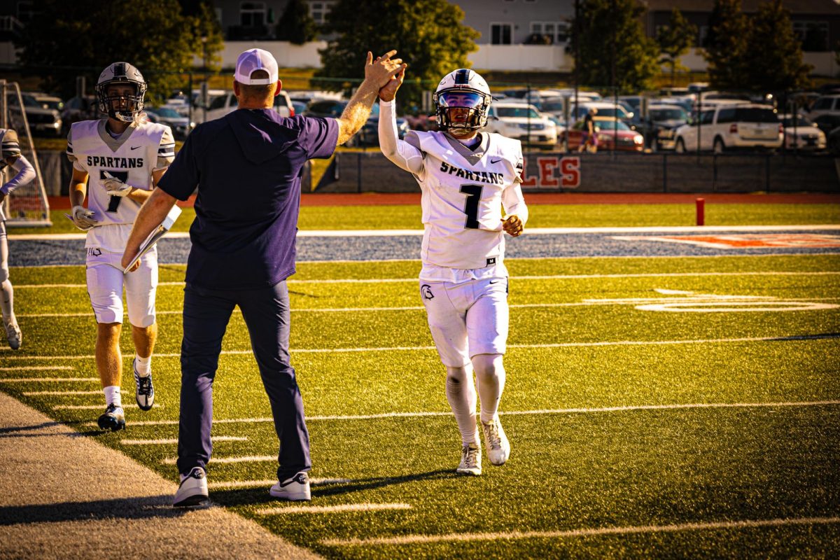 Quarterback Ayden Cox runs it in for a touchdown, and Coach Mattson celebrates Cox’s touchdown. Both Cox and Aholt are splitting reps for the C-Team, struggling to beat one of each out for the starting spot. 