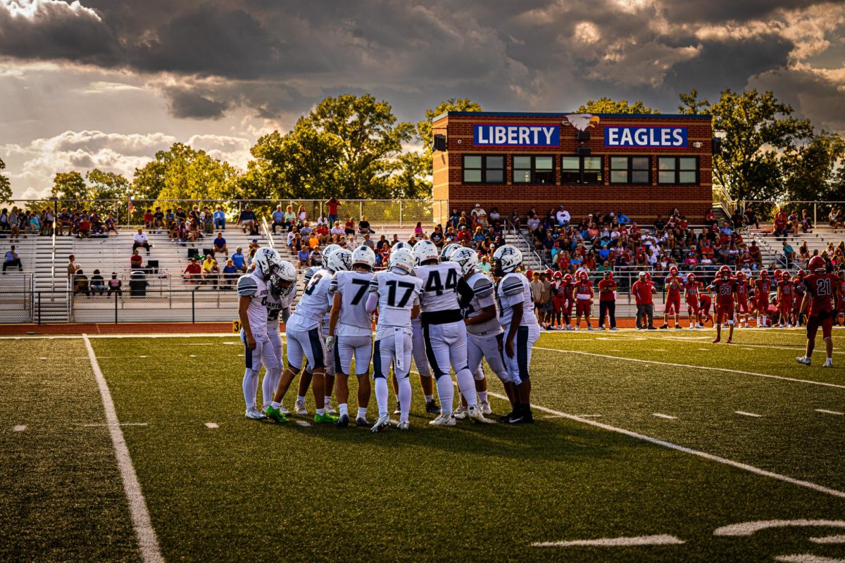 The Spartan offensive huddle, led by Sam Aholt getting ready to start their drive. Great defensive stop by the Spartans, now the offense uses that stop to motivate them to score. 
